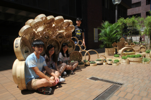 Chan Sze Wah, Lai Shu Yin, Li Issac, with their TA Yuen Chun Yin, taking photo at their installation "Cave – 1.618"