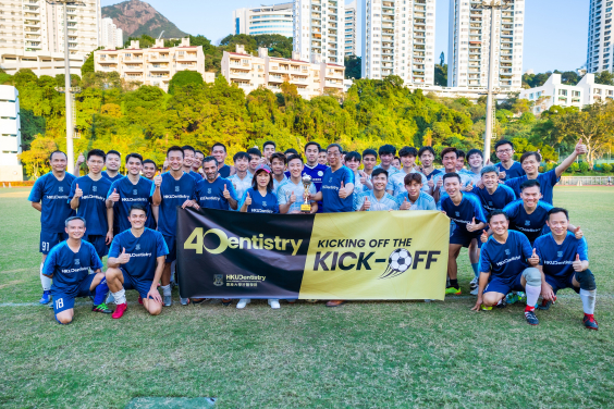 Dr Raymond Lee presents trophy to the student winning team and group photo of the two football teams